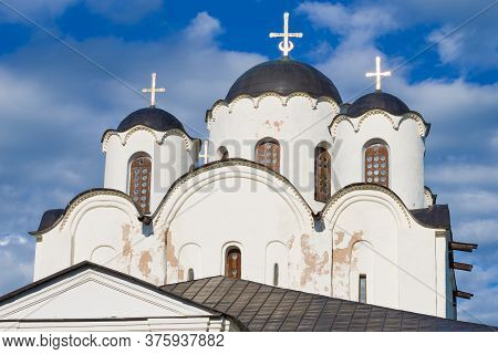 The Top Of The Nikolo-dvorishchenskiy Cathedral (1113) Close-up On A Background Of Cloudy Sky. Velik