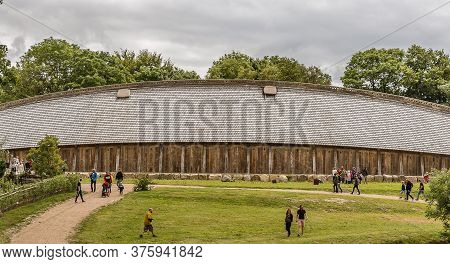 Peopley In Front Of The King's Hall, A Medieval Longhouse In Lejre, Denmark, July 9, 2020