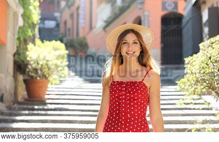 Happy Travel Tourist Woman Going Downstairs In Bellagio On Lake Como, Italy. Girl On Summer Vacation