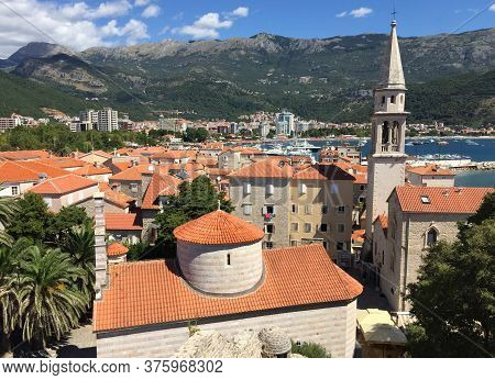 The Beauty Of The City, Shot From Above, Emphasizes The Beautiful Ornament Of Red Tiled Roofs Of Hou