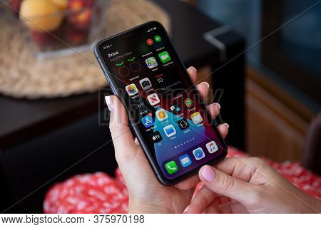 Alanya, Turkey - July 10, 2020: Woman Hand Holding Iphone 11 With Phone Call Widget On The Home Scre