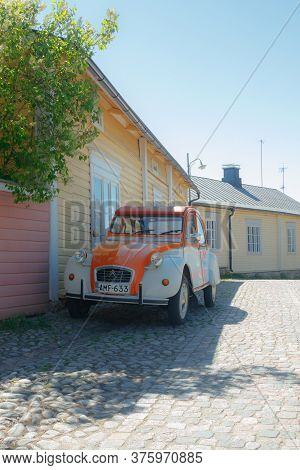 Porvoo, Finland - 3 June 2020: Beautiful Street With Blooming White Lilac And Vintage Car Citroen 2C