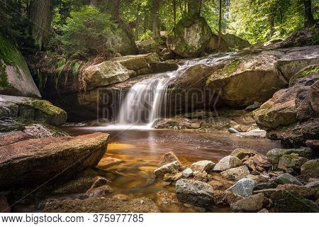 A Water Fall Is Running With Pure Water In The Forest