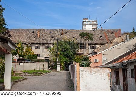 Abandoned Factory And Warehouse With Its Distinctive Crumbled Facade And Roof Structure In Eastern E