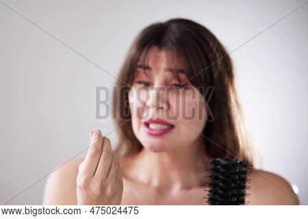 Hairfall And Hairloss. Worried Woman With Hair Loss
