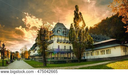October 27 2022- Hotel Central Calimanesti Romania. Sunset With Golden Rays Passing Through Tree Bra
