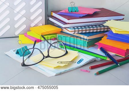 Glasses On The Background Of Colored Pencils And Paper, Selective Focus.