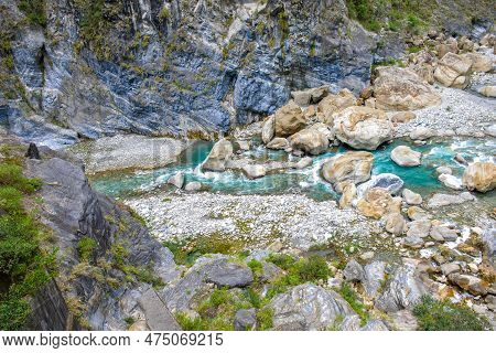 Scenic View Of Swallow Grotto Yanzikou Trail With Narrow Turquoise Liwu River Gorge And High Mountai