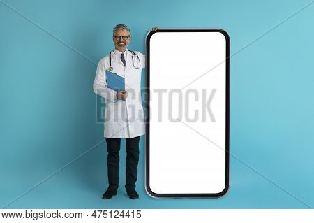 Handsome Grey-haired Doctor With Huge Phone, Mockup