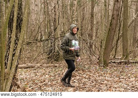 Cute Elderly Caucasian Women Wearing Sportswear Running Through A Forest