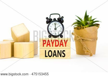 Payday Loans Symbol. Concept Words Payday Loans On Beautiful Wooden Block. Beautiful White Table Whi