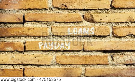 Payday Loans Symbol. Concept Words Payday Loans On Beautiful Red Brown Brick Wall. Beautiful Red Bro