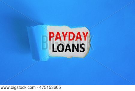 Payday Loans Symbol. Concept Words Payday Loans On Beautiful White Paper. Beautiful Blue Table Blue 