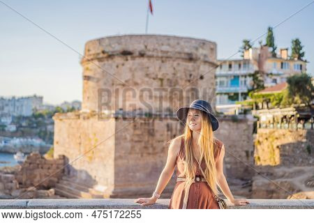 Woman Tourist On Background Of Hidirlik Tower In Antalya Against The Backdrop Of The Mediterranean B