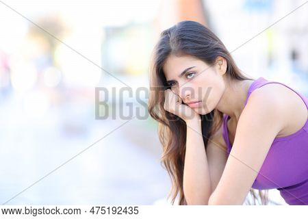Bored Woman Waiting Sitting In The Street