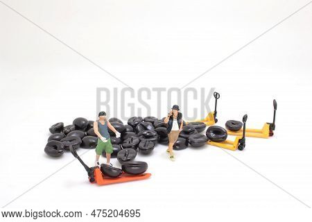 A Worker Using Pallet Jack To Lift Heavy Roasted Coffee Bean