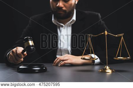 Focus Symbols Of Justice, Gavel Hammer And Scale Balance On Blurred Background Of Thoughtful Lawyer 