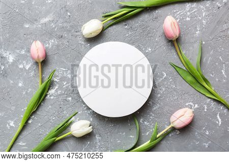 Composition With Blank Card And Beautiful Flowers Tulip On Coloredbackground. Top View With Space Fo
