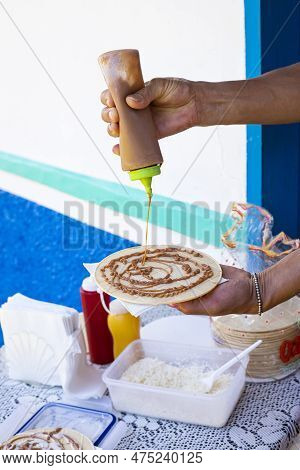 Preparation Of The Wafer With Caramel Sauce, Cheese And Blackberry Sweet - Traditional Colombian Des