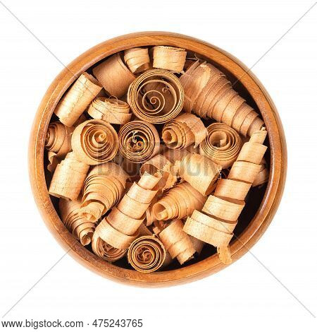 Spiral Shaped Wood Shavings Of Swiss Pine Wood, In A Wooden Bowl. Pinus Cembra, European White Pine 