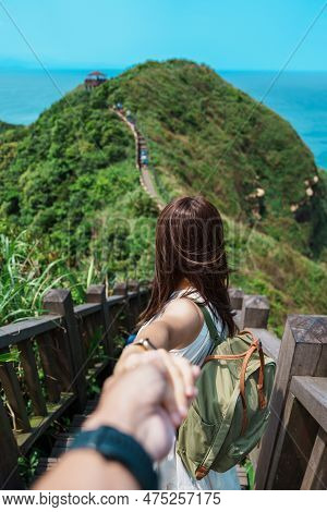 Couple Traveler Visiting In Taiwan, Tourist Sightseeing In Bitou Cape Hiking Trail, New Taipei City.