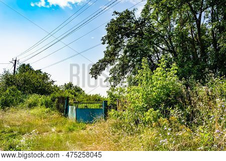 Beautiful Old Gate From Abandoned House In Village On Natural Background