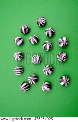 Delicious Humbug Balls Against A Colorful Background
