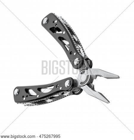 Steel Multitool Isolated On White Background. Opened Multitool With Pliers, File, Blade, Screwdriver
