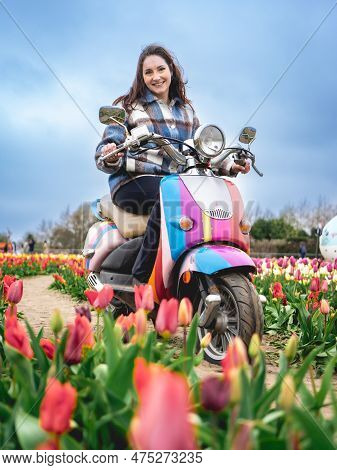 Woman Enjoy The Flower Gardens At The Tulip Barn Hillegom, Netherlands 16 April 2023.