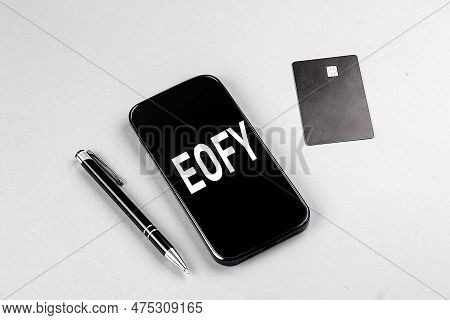 Eofy Word On A Smartphone With Credit Card And Pen