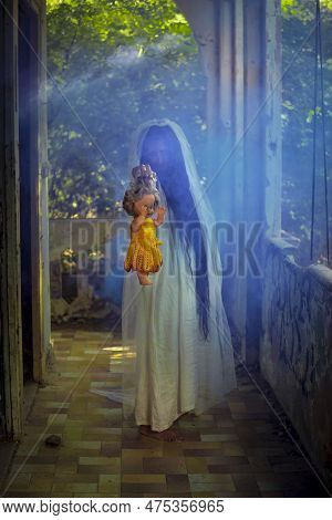 Deranged Bride With A Doll In Abandoned Place. Inspired By The Traditional American Legend Of La Llo