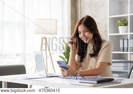 Portrait Of Smiling Beautiful Business Asian Woman Working In Office Use Computer With Copy Space. B