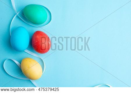 Top View Colored Easter Eggs On Blue Background Easter Holiday Ornate Multi Ethnic Colourful Group C