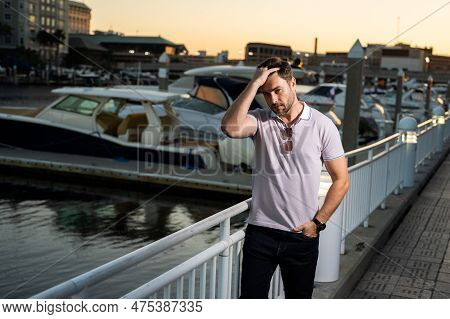 Young Handsome Man In Classik Polo T-shirt On The Street. Handsome Confident Stylish Hipster Model P