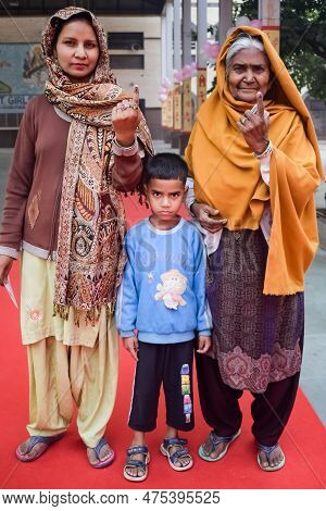 New Delhi, India - December 04 2022 - Unidentified People Showing Their Ink-marked Fingers After Cas
