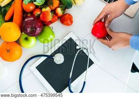 Diet Food Of Fruit And Vegetables For Cholesterol Control With Nutritionist Hands Showing Awareness 