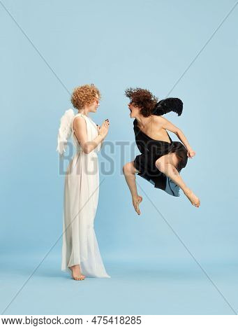 Kindness And Anger. Cte, Tender Girl In Image Of Angel And Emotional Woman In Image Of Devil Against