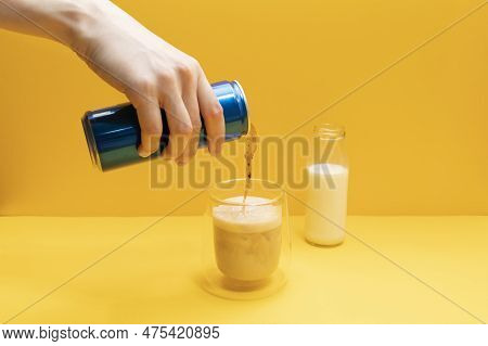 Someone Cooks Pilk, Trendy Dirty Soda Drink. Person Combining Soda And Dairy Beverages. Drinking Gla