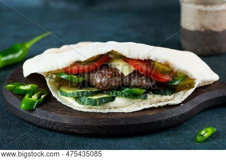 Delicious Pita Bread With Meat, Tomatoes And Pepper. Pita With Kebab. Shawerma With Meat