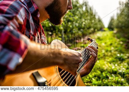 Mans Hands Playing Acoustic Guitar, Close Up. Acoustic Guitars Playing. Music Concept. Guitars Acous