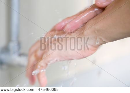 Hand Of Beauty Woman  Wash Your Hands At The Wash Basin With Foam, Cleanse The Skin And Have Water F