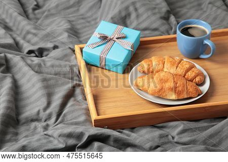 Father's Day Concept With Gift And Breakfast On Tray. Breakfast For Dad With Croissant And Coffee. I