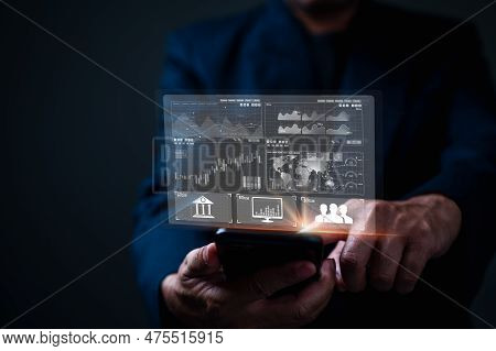 The Successful Businessman Diligently Manages His Finance And Investment Accounts, Leveraging The Ba
