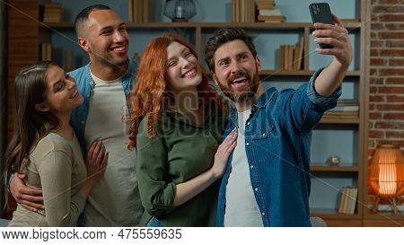 Adult Caucasian Bearded Man Blogger Make Group Selfie Photo With Multiracial Friends On Mobile Phone
