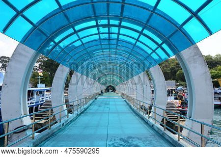 Rayong,thailand - March 16,2023 - A Blue Translucent Roof Walkway At Nadan Pier  Is The Major Samet 
