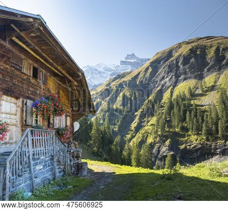 Traditional Swiss House In Mountain Valley Kiental. Tourist And Sport Attraction Of Switzerland.