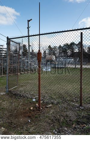 No-potable Water Station Next To A Chain Link Fence