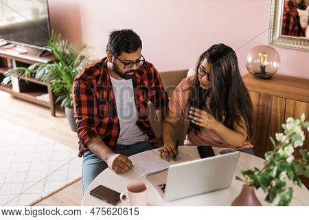 Serious Wife And Husband Planning Budget, Checking Finances, Focused Young Woman Using Online Calcul