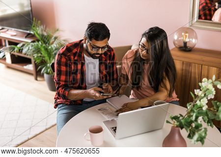 Serious Wife And Husband Planning Budget, Checking Finances, Focused Young Woman Using Online Calcul