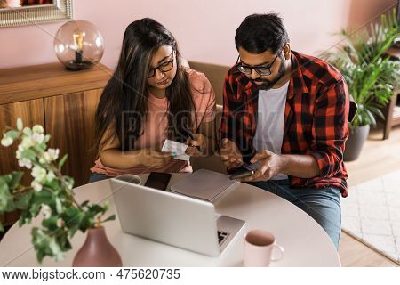 Serious Wife And Husband Planning Budget, Checking Finances, Focused Young Woman Using Online Calcul